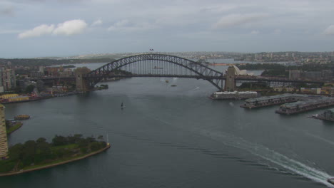 Sydney-Harbour-Bridge-by-Opera-House-in-Australia,-Aerial-Drone-Flight