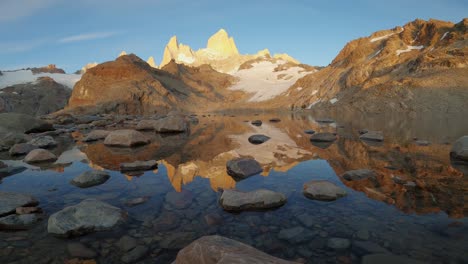 Mount-Fitz-Roy-Timelapse,-Patagonian-Landscape-of-Melt-Lake,-Clean-Water-and-Snowy-Peaks,-Ice-Field-Coast-in-Argentine-and-Chilean-Beautiful-Patagonia