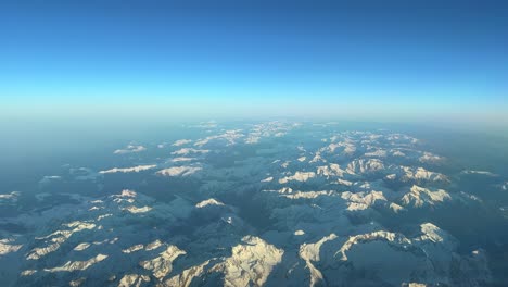 Panoramic-aerial-view-from-a-jet-cockpit-of-the-Pyrenees-mountains-flying-northbound-just-before-sunset