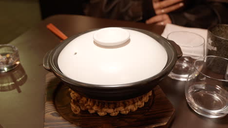 Water-added-to-Wagyu-beef-and-rice-steamer-bowl-in-minimal-Avant-Garde-restaurant