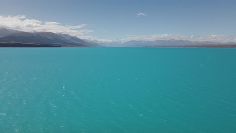 High-angle-view-over-distinctly-blue-glacial-Lake-Pukaki,-Southland,-NZ