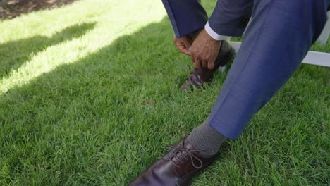 Groom-tying-his-shoelaces