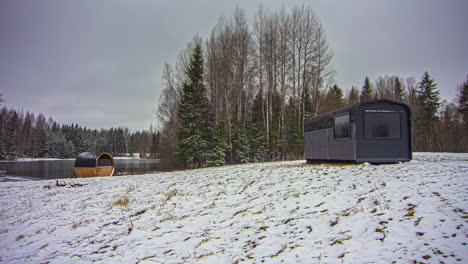 Sauna-hut-in-rural-and-snowy-landscape,-Timelapse