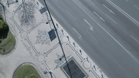 aerial-bottom-up-view-of-sidewalk-in-Lisbon-at-sunny-morning-day