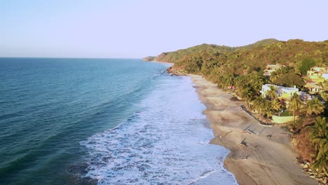 A-drone-views-the-Northern-stretch-of-Sayulita-beach-of-the-Pacific-Ocean-in-Mexico