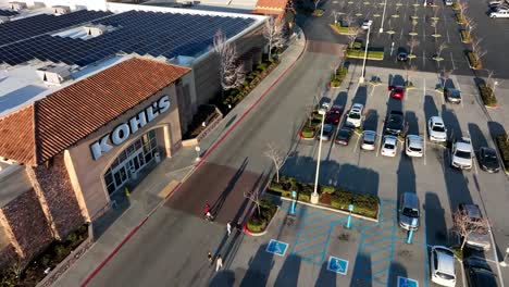 Kohl's-Department-store-in-Santa-Clarita,-California---aerial-flyover-at-sunset