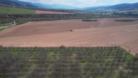 The-drone-view-highlights-the-scale-of-the-monoculture-dead-land-agriculture,-which-can-stretch-for-miles-and-miles,-european-non-organic-agriculture,-ecological-destruction