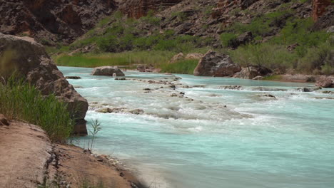 Hidden-Oasis-in-Grand-Canyon-National-Park-USA,-Flowing-Turquoise-Little-Colorado-River-Water,-Slow-Motion