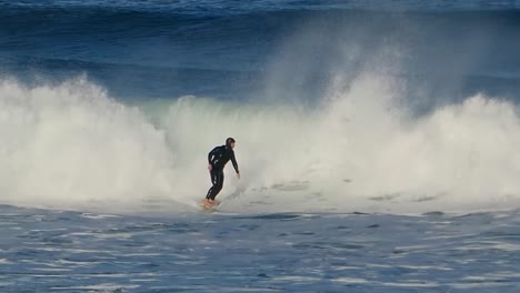 Slow-motion-of-huge-carving-at-the-most-famous-surf-spot-on-the-Portuguese-coast,-Guincho,-Cascais