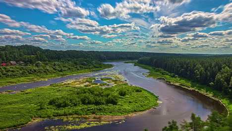 Winding-Daugava-river-with-island-in-woodland-area,-fusion-time-lapse-on-sunny-day