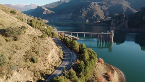 Canales-reservoir-with-still-water-in-a-province-of-Granada-with-mountains-on-both-sides-of-its-banks