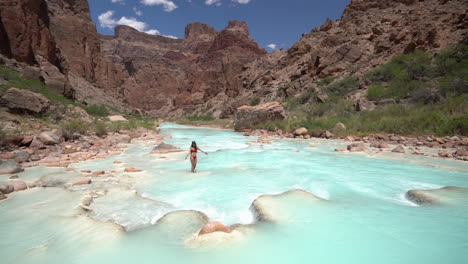Young-Woman-in-Bikini-Enjoying-in-Turquoise-River-Water,-Stunning-Oasis-in-Grand-Canyon-National-Park,-Arizona-USA,-Slow-Motion