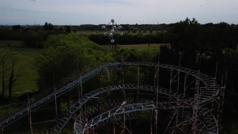 Establisher-aerial-view-of-abandoned-LunaPark-in-Limbiate,-Italy,-circle-pan