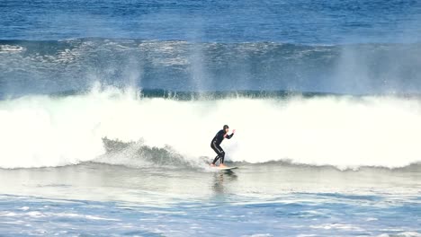 Slow-motion-of-a-large-roundhouse-at-the-most-famous-surf-spot-on-the-Portuguese-coast,-Guincho,-Cascais