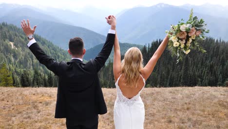 Happy-groom-and-bride-at-their-wedding-in-the-mountains