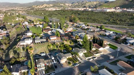 Aerial-view-Santa-Clarita-mountain-valley-and-city-in-California-sun