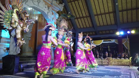 Traditional-Cultural-Dance-of-Bali,-Indonesia,-Girls-Walking-with-Offerings,-Balinese-Dancers-performing-Sekar-Jagat-in-Karangasem-Cultural-Art-Temple-in-Colorful-Costumes