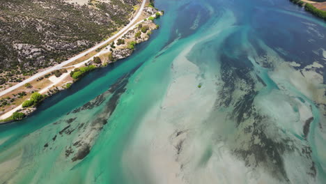 Turquoise-water-of-Clutha-river-by-Lake-Dustan,-New-Zealand,-aerial-panorama