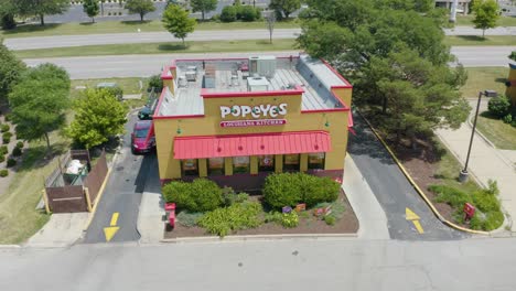 Aerial-Establishing-Shot,-Popeyes-Louisiana-Kitchen-Fast-Food-Restaurant-Company-in-United-States