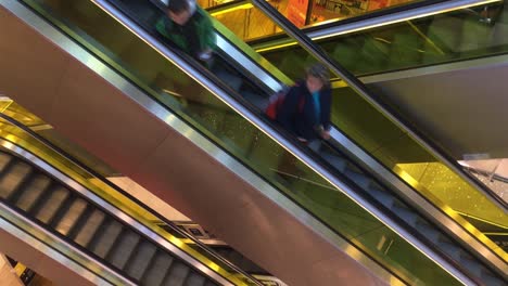 Time-lapse-of-escalator-or-moving-staircase-in-shopping-mall-during-Christmas-season-with-people