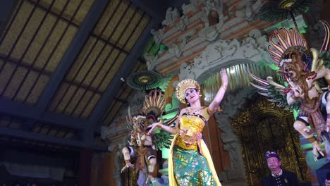 Oleg-Dance-in-Bali-Indonesia,-Balinese-Beautiful-Woman-Performs-Art-Choreography-with-Colorful-Costume-and-Crown,-Makeup-and-Traditional-Jewellery