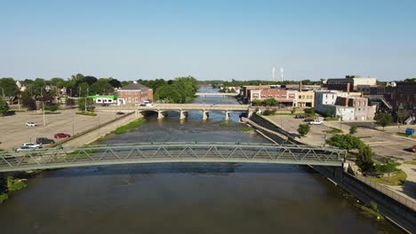 Low-aerial-view-along-Raisin-River,-through-Monroe-Michigan