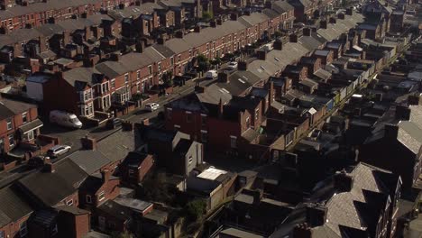 Aerial-view-reveals-rows-of-historic-terraced-houses-in-Dentons-Green,-St-Helens-establishing-street-view
