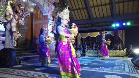 Balinese-Dancers-With-Flower-Offerings,-Golden-Crowns-and-Colorful-Fabrics,-Bali-Dance-Performance-in-Karangasem-Village,-Indonesia,-Southeast-Asia,-Sekar-Jagat-Choreography