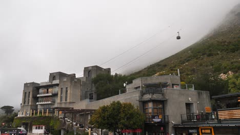 Table-Mountain-Aerial-Cableway-cabin-ascends-cable-in-Cape-Town-fog