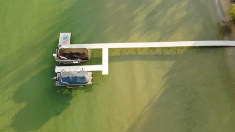 Aerial-view-over-one-of-the-mane-pontoons-on-Lake-Leelanau,-Leland-Michigan,-USA