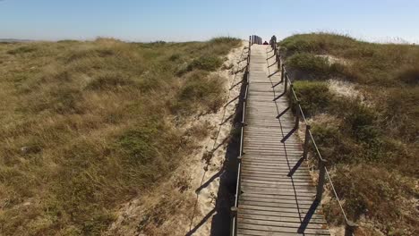Flying-Over-Walkway-in-direction-To-The-Beach-Over-Dunes