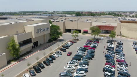 Aerial-Orbiting-Shot-Reveals-JCPenney-Store-at-Busy-Mall-on-Hot-Summer-Day