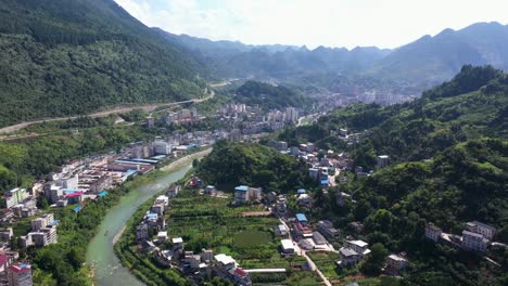 Village-aerial-in-Hubei-Province,-Hefeng-County,-above-the-Loushui-river