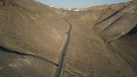 bird's-eye-view-over-the-asphalt-road-in-the-valley-of-los-ajaches-in-the-south-western-region-of-Lanzarote-island