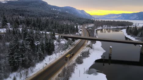 Panoramic-River-View:-Majestic-Thompson-River-in-British-Columbia,-Surrounded-by-Winter-Laden-Forest-and-Highways