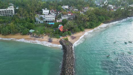 Aerial-shot-of-Turtle-Bay-Beach-Resort-at-sunrise-in-Mirissa,-Sri-Lanka