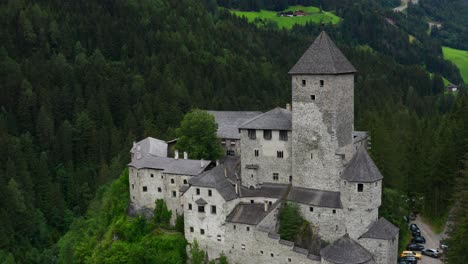 Aerial-View-Of-Taufers-Castle,-Grand-Medieval-Castle-On-A-Hill-In-Alto-Adige,-Italy