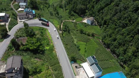Low-aerial-shot-over-Winding-Roads-with-cars-driving-in-Hebei-Province,-China