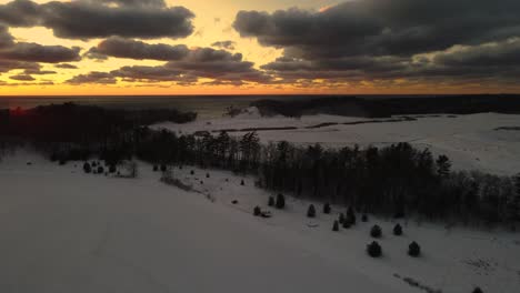 Winterland-sunset,-reverse-descending-motion-with-turn