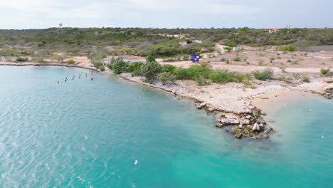 Aerial-view-of-beautiful-Playa-Cabo-Rojo-and-field-in-background-during-construction-phase-for-new-hotels