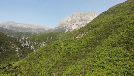 Drone-Video-Flying-to-Vikos-Gorge-Canyon-summer-day-panning-left-Astraka-Towers