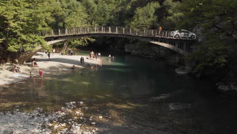 Drone-video-Voidomatis-River-Papingo-Greece-flying-over-a-bridge