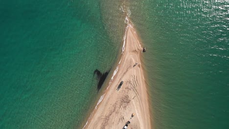 Drone-video-flying-over-a-cape-sandy-beach-summer-sunny-hot-day-Greece