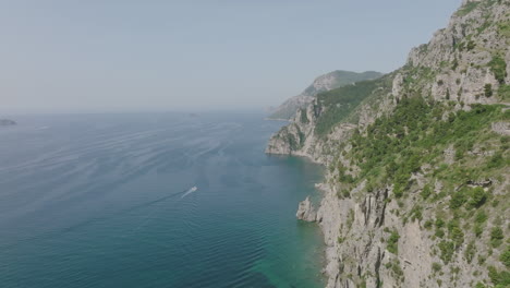 Wide-aerial-footage-on-the-Amalfi-coast-showing-a-boat-on-the-Mediterranean-Sea