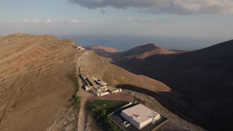 Drone-flight-along-the-Los-Ajaches-mountain-peaks,-Lanzarote,-Canary-Island