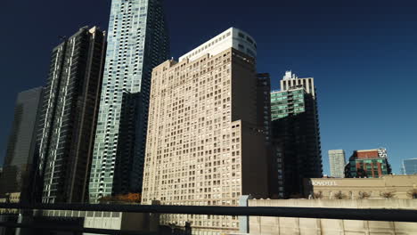 Exterior-wide-shot-seen-from-a-moving-car-of-the-Toronto-skyline-on-a-beautiful-sunny-day