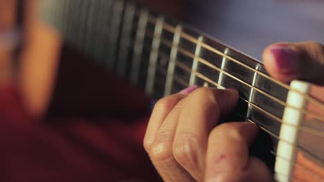 Female-Guitarist-Playing-Guitar.---close-up