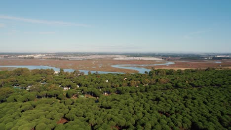 Explore-the-Unique-Wetlands-of-Huelva,-Spain:-An-Aerial-Pull-Out-Shot