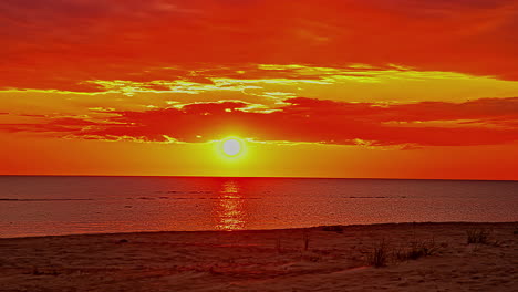 Bright-red-sunrise-above-seascape-horizon,-fusion-time-lapse