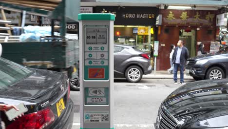 Large-digital-Parking-ticket-machine-on-the-sidewalk,-Tsim-Sha-Tsui